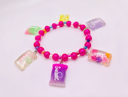 Hot pink beaded bracelet with pearls, sweet candy charms