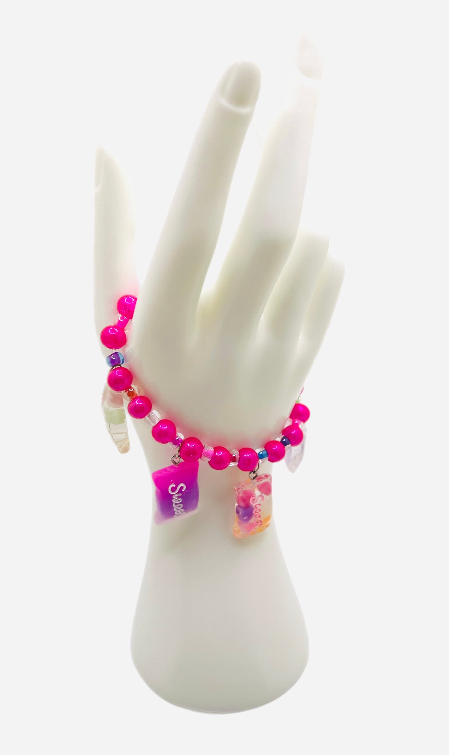 Hot pink beaded bracelet with pearls, sweet candy charms