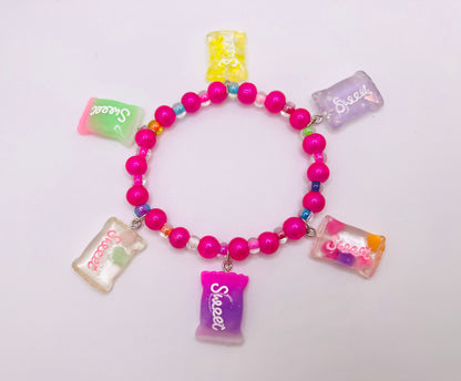 Hot pink beaded bracelet with pearls, sweet candy charms